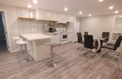 Southwest Calgary House | Beautiful two bedroom and an office lower level suit