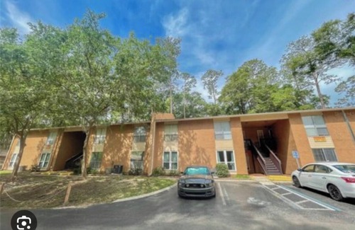 Gainesville Condo | Bedroom within 3BR condo - dog friendly