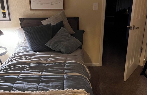Gainesville Condo | Bedroom within 3BR condo - dog friendly