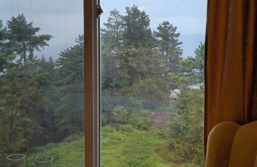 Bhurban Apartment | Bhurban Nights - High Floor with mountains views from each of 3 rooms.