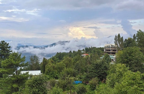 Bhurban Apartment | Bhurban Nights - High Floor with mountains views from each of 3 rooms.