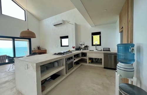 Gregory Town House | Big Pink:nmid-century modern 2bedroom oceanfront home on cliffs of Gregory Town