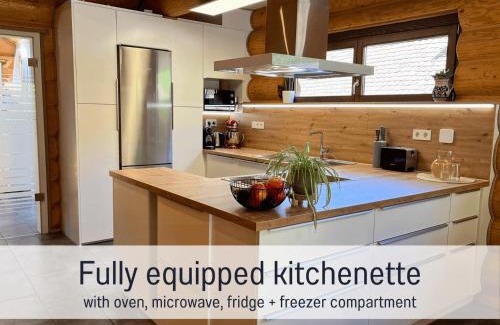 Laslea Apartment | Blockhaus Malmkrog with garden, bright rooms, and an open kitchen
