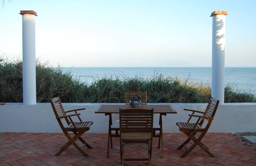 Caucana-finaiti-casuzze-finaiti Nord House | Blue House: terrace and veranda overlooking the sea from the garden. Beach access from home