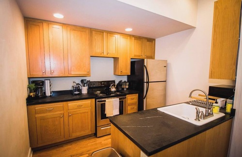 Greeley Apartment | Brick & Balcony Greeley Retreat