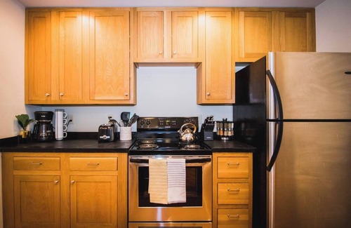 Greeley Apartment | Brick & Balcony Greeley Retreat