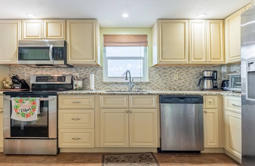 New Smyrna Beach Condo | Bright & Cozy Poolside Retreat in Oceanfront New Smyrna Beach Condo!