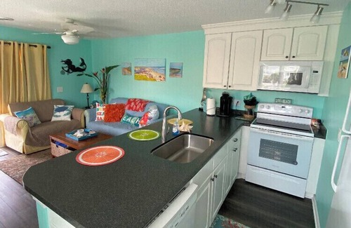 North Carolina Coast Condo | Bright end unit, Ocean Views, 1st floor, Pool, Double Decks, Keyless Entry