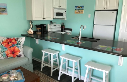North Carolina Coast Condo | Bright end unit, Ocean Views, 1st floor, Pool, Double Decks, Keyless Entry