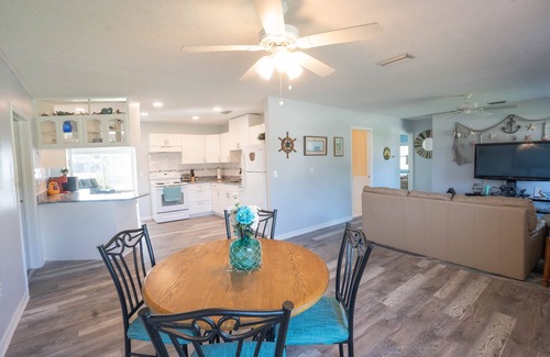 Gulf Cove House | Bright Waterfront Home. Heated Pool. Short drive to Beach. Beautiful Sunsets.