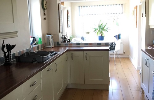 Caergeiliog House | Bungalow in Trearddur Bay, 4 min drive from beach & with open countryside views,