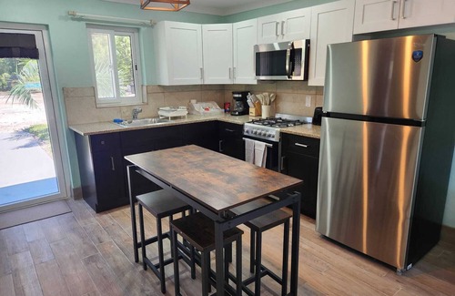 Rock Sound Apartment | By the Bay - Brand New Apartment, Steps to the Sea, Walk to Town