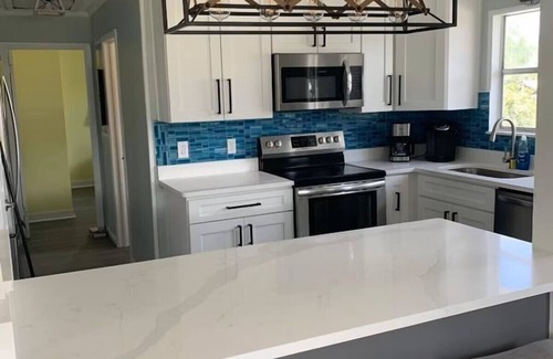 Butler Beach House | Cabana Escape – Waterfront Oasis with Heated Pool and Spacious Outdoor Living