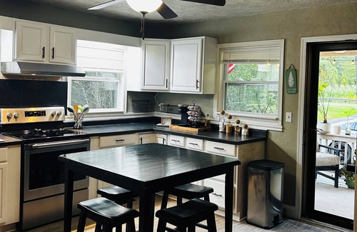 Bellville Cabin | Cabin By The Creek nestled on 3 acres with a hot tub in welcoming Bellville