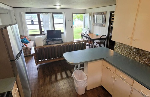 Alto House | Campau Lake Sunshine, hot swim spa tub, King Bed lakefront