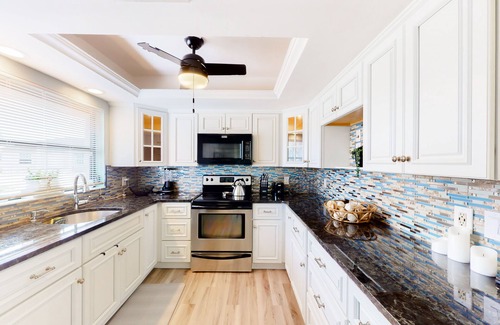 Charlotte Park House | Canal-front home with private dock, pool, screened lanai, & W/D