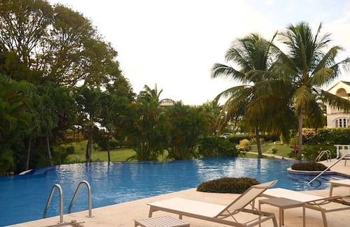 Merlin Bay Apartment | Caribbean Queen is located on the exclusive Royal Westmoreland Golf Resort