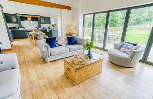 Bodorgan Cottage | Carrog Barn - a ground floor bedroom that sleeps 6 guests in 3 bedrooms