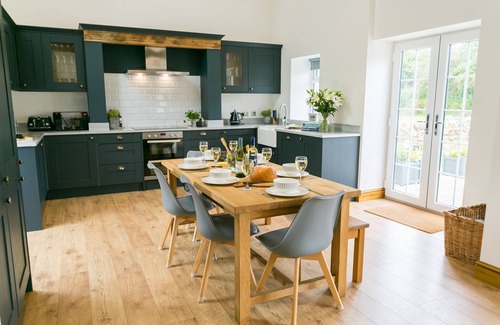 Bodorgan Cottage | Carrog Barn - a ground floor bedroom that sleeps 6 guests in 3 bedrooms