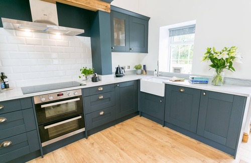 Bodorgan Cottage | Carrog Barn - a ground floor bedroom that sleeps 6 guests in 3 bedrooms