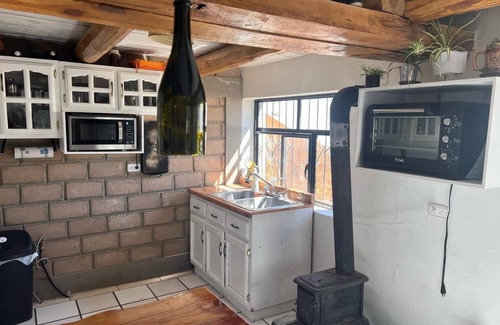Creel Cabin | Casa MiRó Creel, a cozy place with an indoor fireplace.