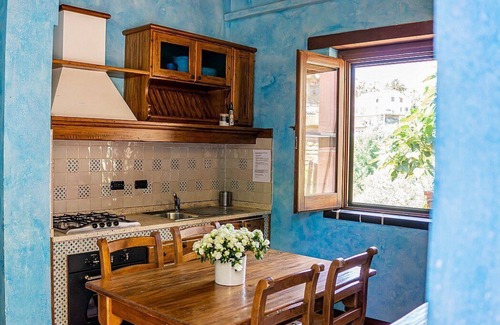 Casal Velino House | Casa Rosamunda A: A graceful apartment that is part of a villa surrounded by the greenery, with Free WI-FI.