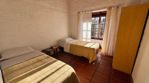 Las Rosas House | Casita cercana a plaza de Villa de las Rosas con patio y asador