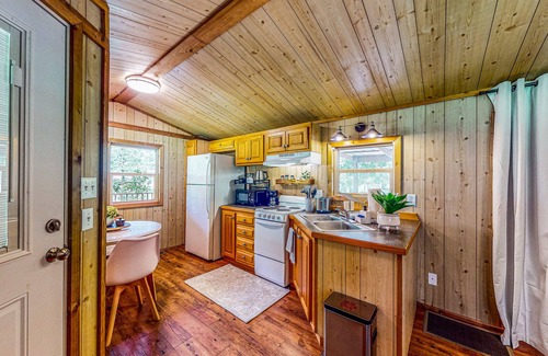 Waller Cabin | Cedar cabin with pretty pond, beach, swimming deck & tropical hut/bar