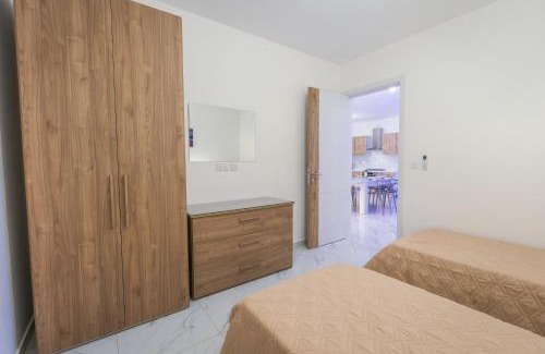 Qawra Apartment | Central Comfort Apartment - Steps From All Amenities