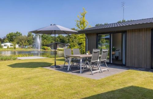 Municipality of Veldhoven Ski Chalet | Chalet by Pond in Eindhoven Holiday Park