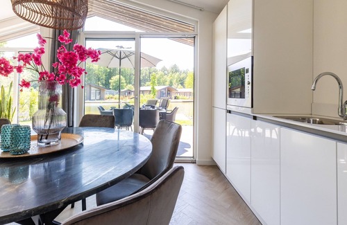 Municipality of Veldhoven Ski Chalet | Chalet by Pond with Sauna