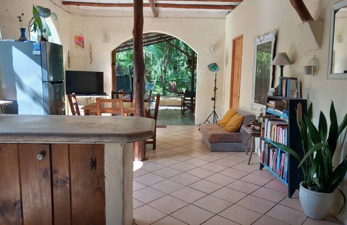 Buenos Aires Ski Chalet | Chalet with jungle view deck on a river in lively Santa Teresa's surf town