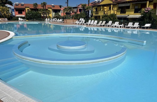 Aprilia Marittima Apartment | Charming apartment with private garden and swimming pool in Aprilia Marittima