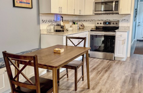 Florida Area House | Charming Blue Retreat with home gym, EV hookups, king bed, and more