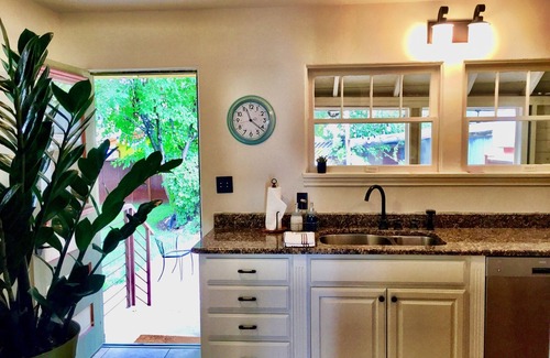 Moab Cottage | Charming cottage off Main Street. Cool summer gardens. Warm winter fireplace
