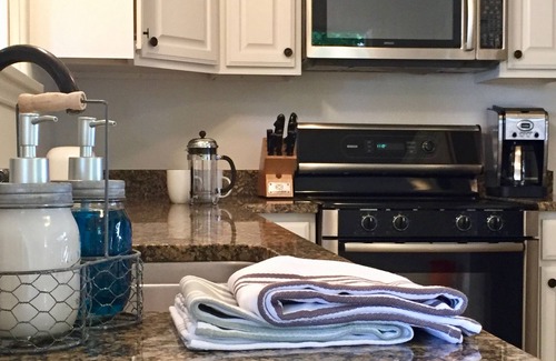 Moab Cottage | Charming cottage off Main Street. Cool summer gardens. Warm winter fireplace
