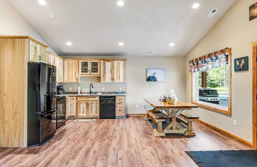 Conover House | Charming dog-friendly cabin with hot tub, fireplace, patio, grill, & central AC