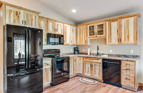 Conover House | Charming dog-friendly cabin with hot tub, fireplace, patio, grill, & central AC