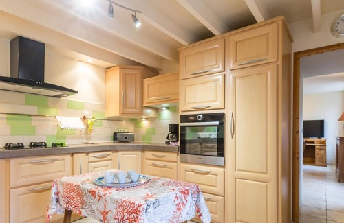 Besneville Cottage | Charming Family Retreat with Garden, Near Beach, Fireplace, and Modern Amenities