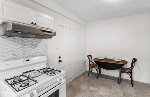 Mooringsport House | Charming Ivy House has cozy living spaces adorned with charming decor and inviting furnishings.