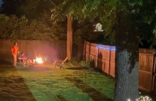 Riverhead House | Charming Riverhead home with large outdoor patio & backyard firepit
