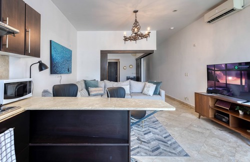 Libertad Apartment | Charming & sunlit condo with pool & balcony - near golf, beaches, & nightlife