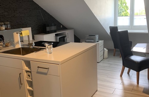 Furstenfeldbruck District Apartment | Chic attic apartment with full furnishings and parking space on the outskirts of Munich