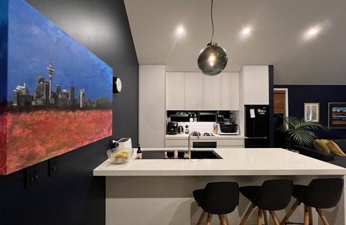 Hobsonville House | Chic, modern designer oasis on city fringe with large spa pool. Great kitchen!