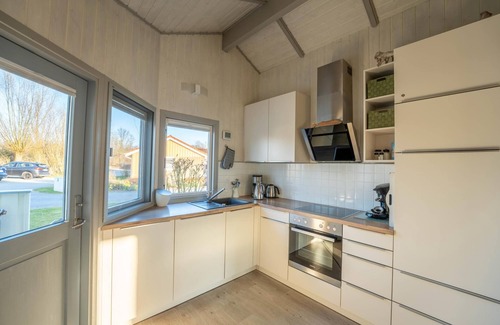 Norderteil House | Child-friendly 5-person wellness holiday home Treibholz with two showers and toilets, sauna, whirlpool, wood-burning stove, conservatory and canoe in Otterndorf