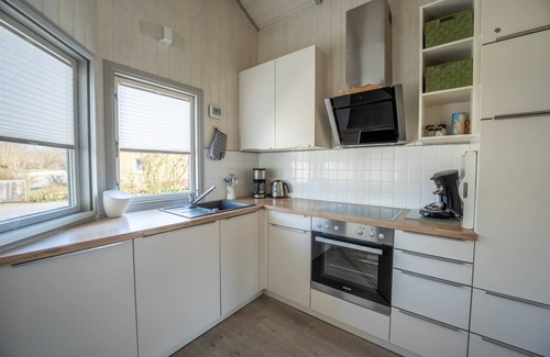 Norderteil House | Child-friendly 5-person wellness holiday home Treibholz with two showers and toilets, sauna, whirlpool, wood-burning stove, conservatory and canoe in Otterndorf