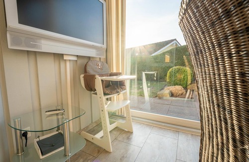 Norderteil House | Child-friendly 5-person wellness holiday home Treibholz with two showers and toilets, sauna, whirlpool, wood-burning stove, conservatory and canoe in Otterndorf