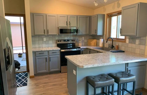 Durand House | Chippewa Riverfront Retreat Sleeps 8 and Hot Tub