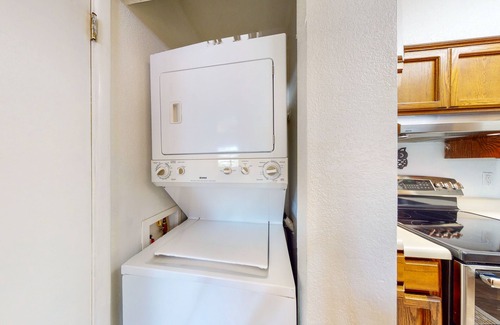 Dietz Condo | Classic condo with a balcony, washer/dryer, central AC, pool