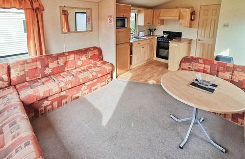 Narberth House | Comfortable and spacious 12ft-wide caravan with one double and two twin.